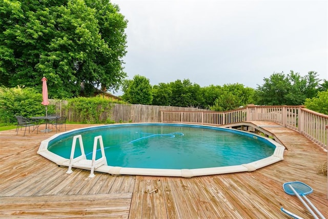 3414 Clayton Dr, Tuttle, OK 73089 - view of swimming pool featuring a deck and outdoor dining area