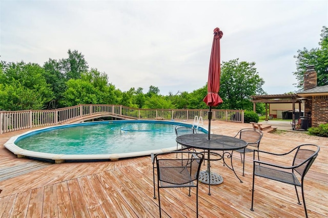 3414 Clayton Dr, Tuttle, OK 73089 - view of pool with a wooden deck