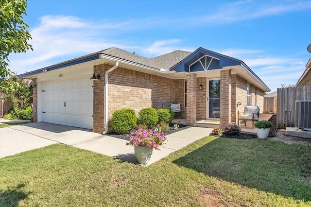2336 NW 197th St, Edmond, OK 73012 - single story home with an attached garage, brick siding, driveway, and roof with shingles