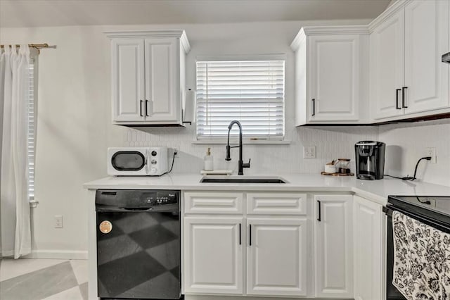 2336 NW 197th St, Edmond, OK 73012 - kitchen with dishwasher, white microwave, white cabinetry, and stainless steel range with electric stovetop