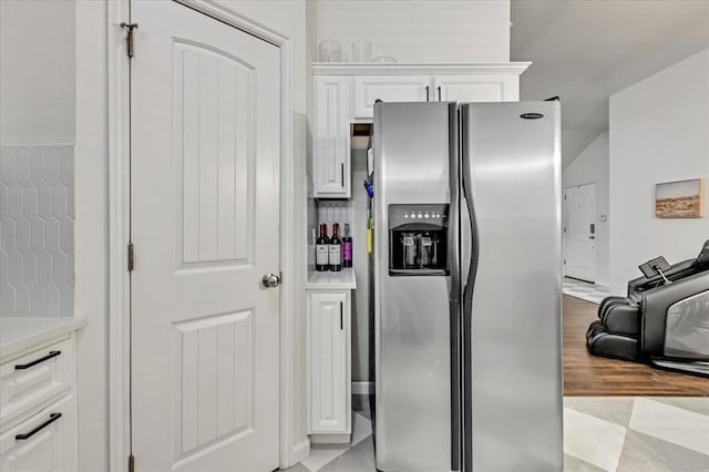 2336 NW 197th St, Edmond, OK 73012 - kitchen featuring stainless steel refrigerator with ice dispenser, white cabinets, light countertops, and light wood-type flooring