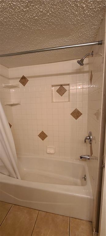 2628 N Ann Arbor Ave Unit 102, Oklahoma City, OK 73127 - full bathroom with tile patterned flooring and shower / bathtub combination with curtain