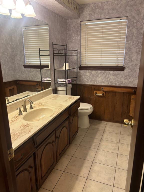 5517 S Karen St, Oklahoma City, OK 73135 - bathroom featuring vanity, tile patterned flooring, a wainscoted wall, and a chandelier