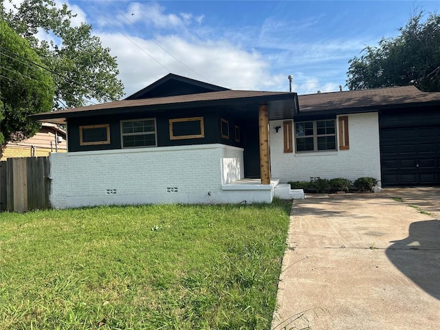 5326 NW Columbia Ave, Lawton, OK 73505 - ranch-style home featuring brick siding, a garage, and driveway