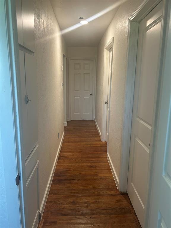 5326 NW Columbia Ave, Lawton, OK 73505 - hall with dark wood finished floors and a textured wall