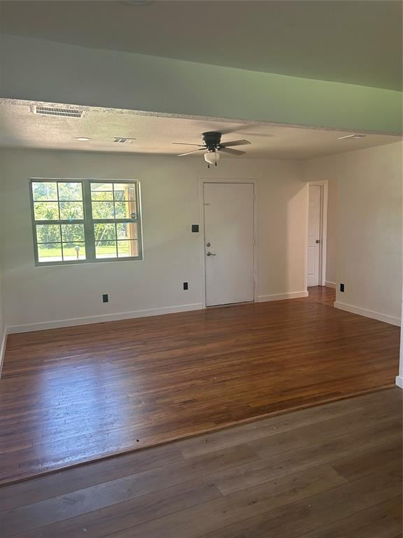 5326 NW Columbia Ave, Lawton, OK 73505 - spare room featuring ceiling fan and dark wood-style floors