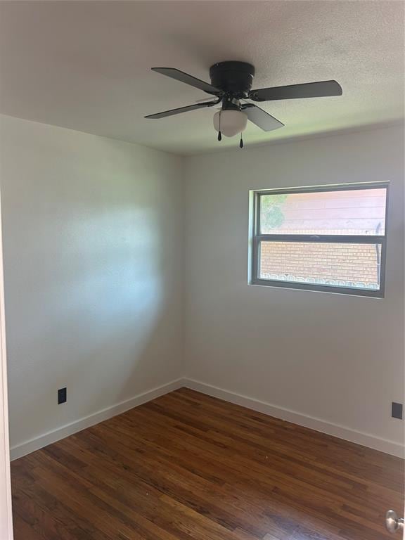 5326 NW Columbia Ave, Lawton, OK 73505 - spare room with dark wood-type flooring and ceiling fan