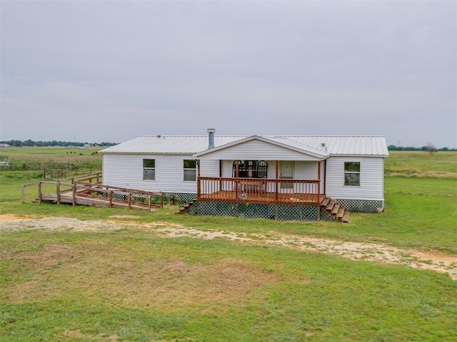 11924 W County Rd 74, Crescent, OK 73028 - back of property featuring a lawn, a deck, and a metal roof