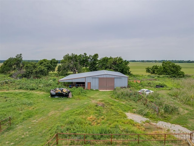 11924 W County Rd 74, Crescent, OK 73028 - view of yard featuring an outbuilding, an outdoor structure, a detached garage, and a view of rural / pastoral area