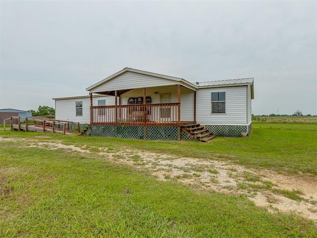 11924 W County Rd 74, Crescent, OK 73028 - back of house with a porch, a yard, and a metal roof