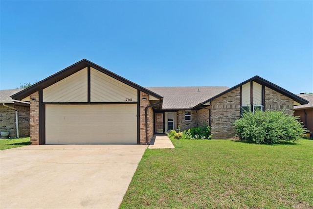 708 Cactus Ct, Yukon, OK 73099 - view of front of home featuring an attached garage, a front lawn, driveway, and brick siding