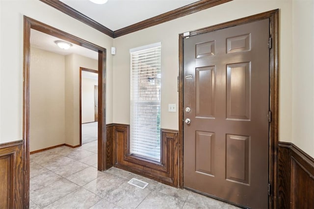 708 Cactus Ct, Yukon, OK 73099 - foyer featuring wainscoting, crown molding, and light tile patterned floors