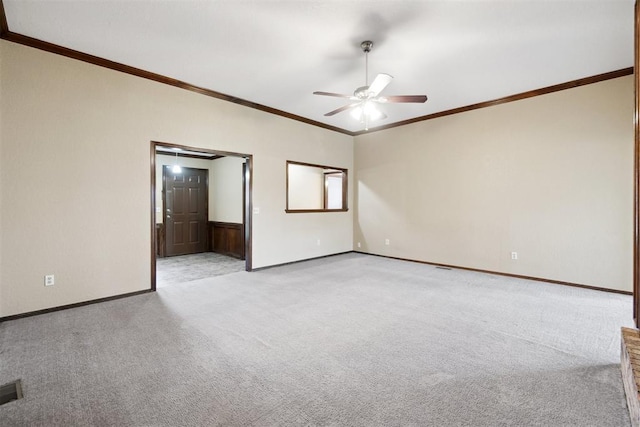708 Cactus Ct, Yukon, OK 73099 - spare room featuring a ceiling fan, light colored carpet, and ornamental molding