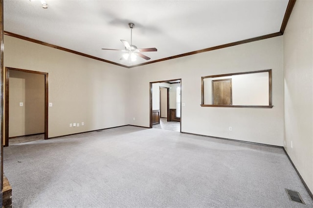 708 Cactus Ct, Yukon, OK 73099 - spare room featuring ceiling fan, carpet floors, and crown molding