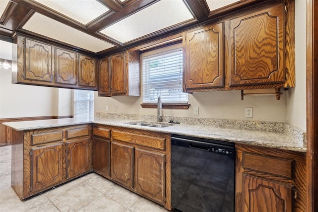 708 Cactus Ct, Yukon, OK 73099 - kitchen with black dishwasher, a peninsula, light countertops, and light tile patterned floors