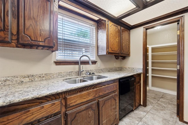 708 Cactus Ct, Yukon, OK 73099 - kitchen featuring black dishwasher, light tile patterned floors, and light stone counters
