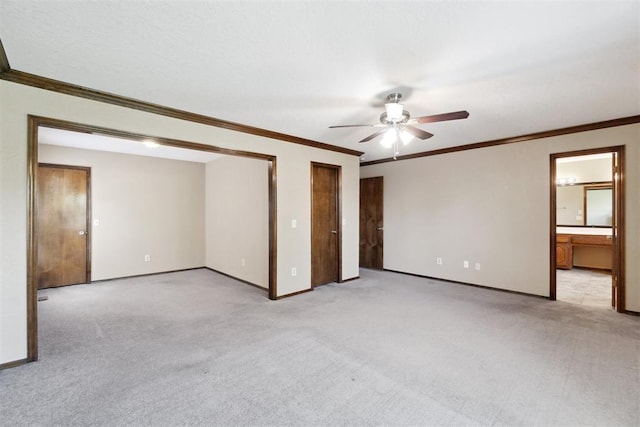 708 Cactus Ct, Yukon, OK 73099 - unfurnished bedroom with carpet floors, ornamental molding, multiple closets, ensuite bath, and a ceiling fan