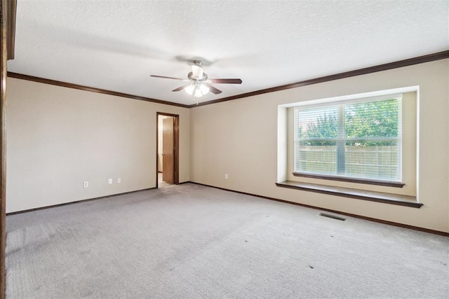 708 Cactus Ct, Yukon, OK 73099 - empty room with carpet floors, crown molding, ceiling fan, and a textured ceiling