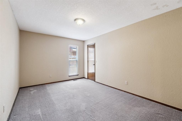 708 Cactus Ct, Yukon, OK 73099 - carpeted spare room with baseboards and a textured ceiling