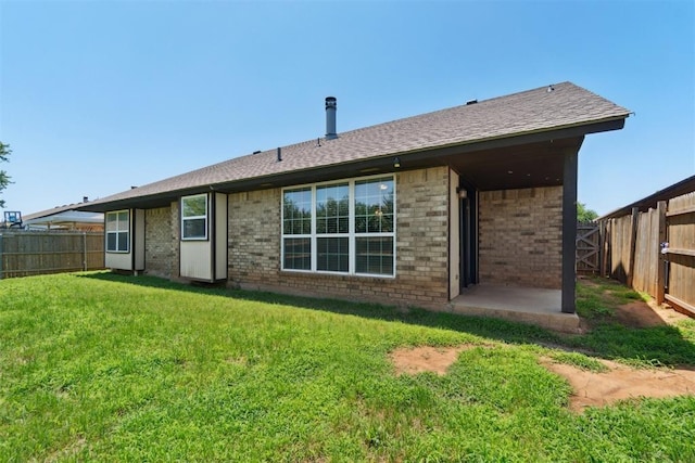 708 Cactus Ct, Yukon, OK 73099 - back of property with brick siding, a fenced backyard, and a shingled roof