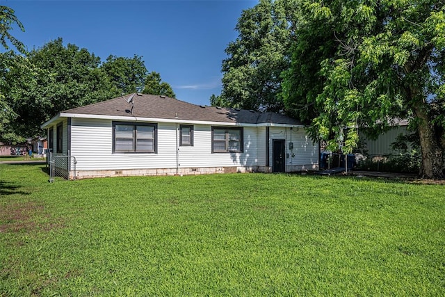 406 SW 4th St, Tuttle, OK 73089 - rear view of house featuring crawl space, a yard, and a shingled roof