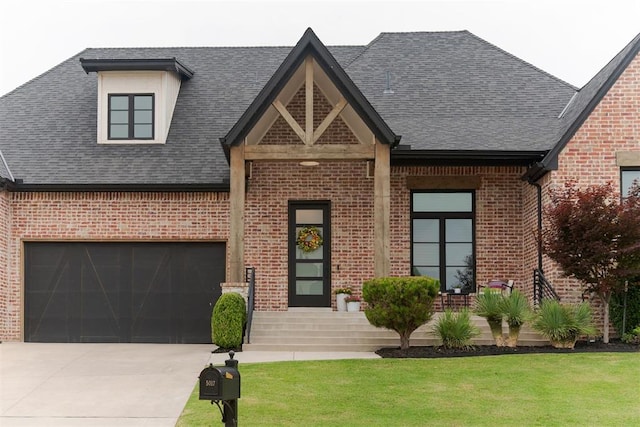 5017 Yale Bridge Ct, Edmond, OK 73034 - view of front of home with brick siding, driveway, a front yard, and roof with shingles