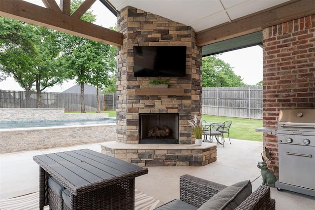 5017 Yale Bridge Ct, Edmond, OK 73034 - fenced backyard featuring an outdoor stone fireplace, a grill, and a patio