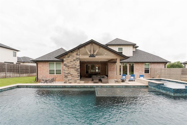 5017 Yale Bridge Ct, Edmond, OK 73034 - view of swimming pool with an outdoor living space, a ceiling fan, a fenced backyard, a patio, and a pool with connected hot tub