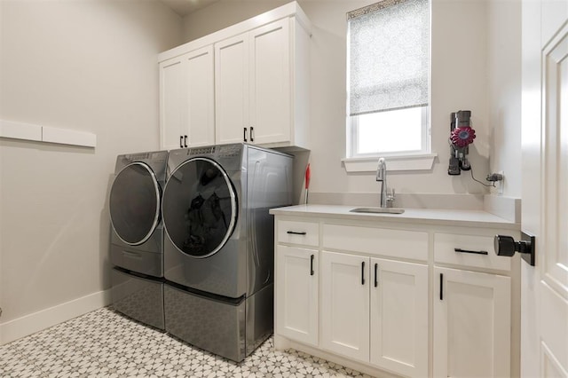 5017 Yale Bridge Ct, Edmond, OK 73034 - laundry area featuring cabinet space, washer and dryer, and light floors