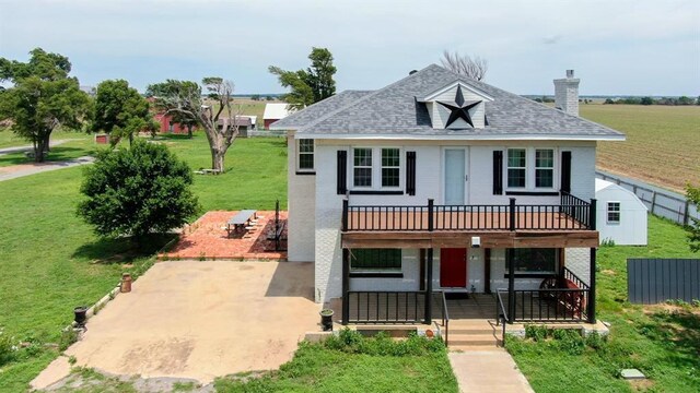 15274 US Highway 283, Blair, OK 73526 - view of front of home with a front lawn, a chimney, a deck, and a patio