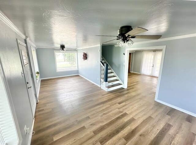 15274 US Highway 283, Blair, OK 73526 - foyer entrance with a ceiling fan, stairs, crown molding, and wood finished floors