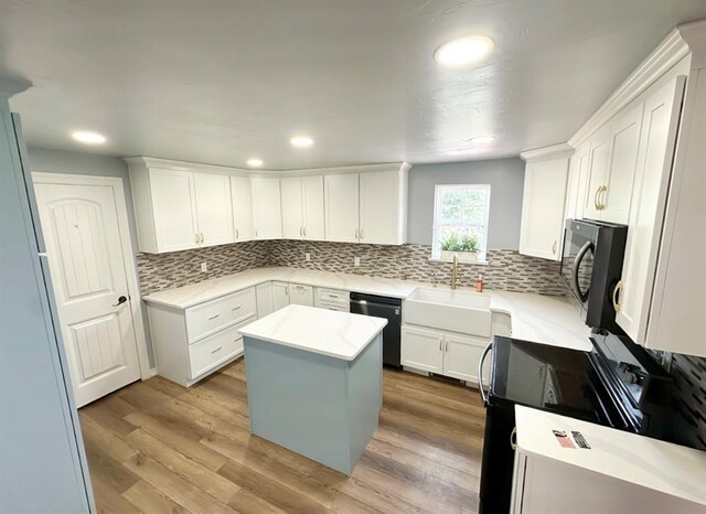 15274 US Highway 283, Blair, OK 73526 - kitchen with dishwasher, backsplash, white cabinetry, black microwave, and recessed lighting