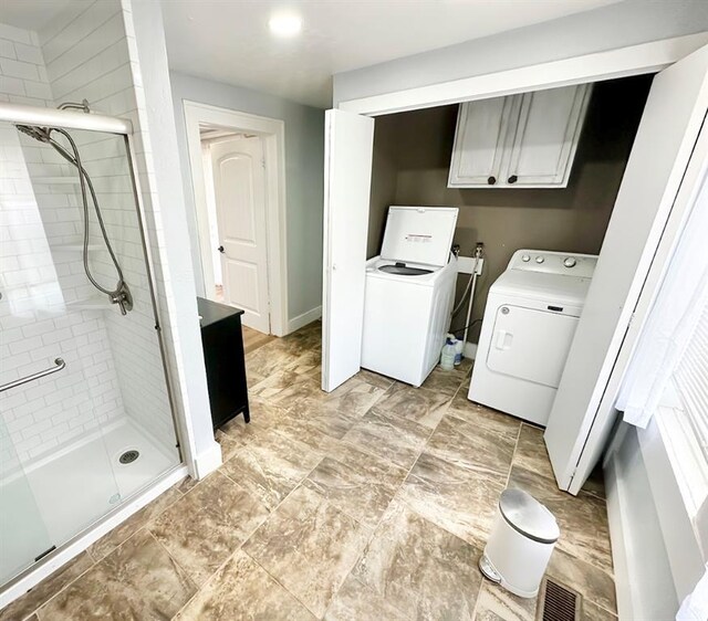 15274 US Highway 283, Blair, OK 73526 - laundry area with washer and clothes dryer and cabinet space
