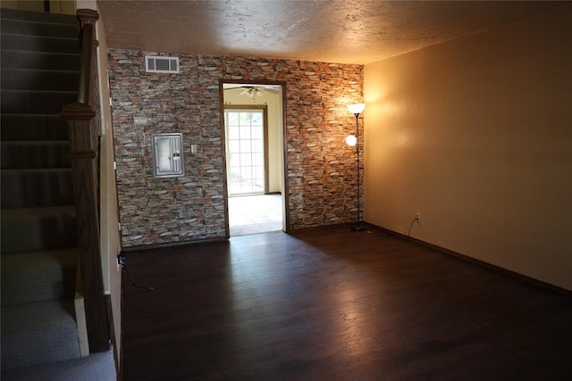 3823 N Harvard Ave Unit 12, Oklahoma City, OK 73122 - empty room with wood finished floors and a textured ceiling