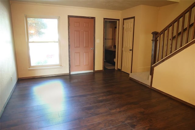 3823 N Harvard Ave Unit 12, Oklahoma City, OK 73122 - foyer entrance featuring stairs, dark wood-type flooring, and crown molding