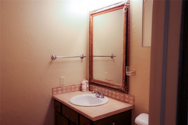 3823 N Harvard Ave Unit 12, Oklahoma City, OK 73122 - bathroom featuring vanity and toilet