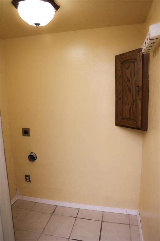 3823 N Harvard Ave Unit 12, Oklahoma City, OK 73122 - laundry room with electric dryer hookup and light tile patterned floors