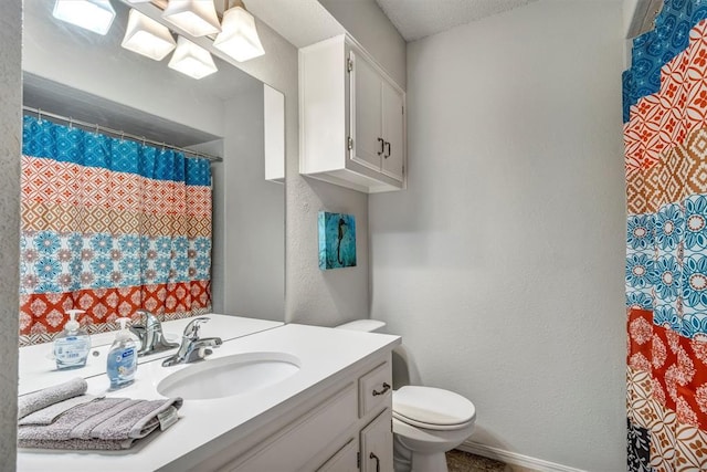 1713 Shadow Ct, Edmond, OK 73013 - full bathroom featuring vanity, a textured wall, and curtained shower