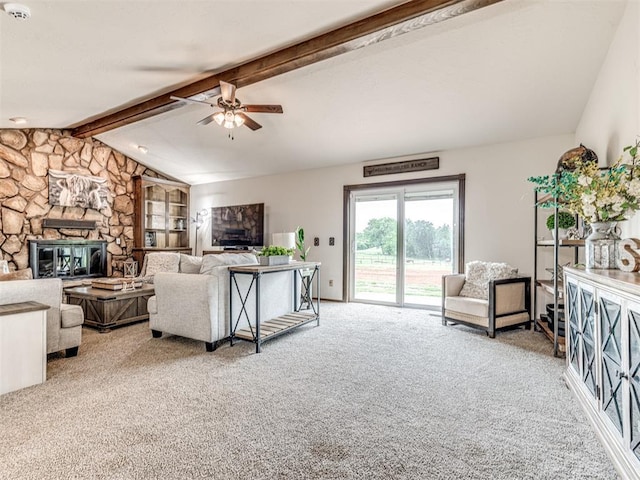 8001 84th St, Noble, OK 73068 - living room featuring a ceiling fan, a stone fireplace, and carpet