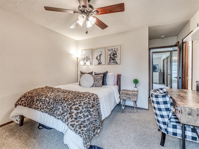 8001 84th St, Noble, OK 73068 - carpeted bedroom featuring a textured ceiling and a ceiling fan