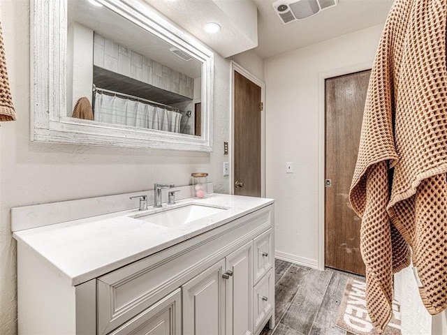 8001 84th St, Noble, OK 73068 - bathroom with vanity and wood finished floors