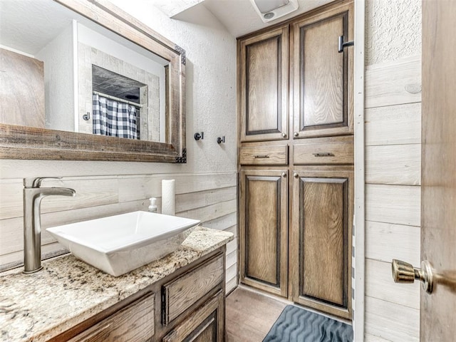 8001 84th St, Noble, OK 73068 - full bath with vanity, a textured wall, and a shower