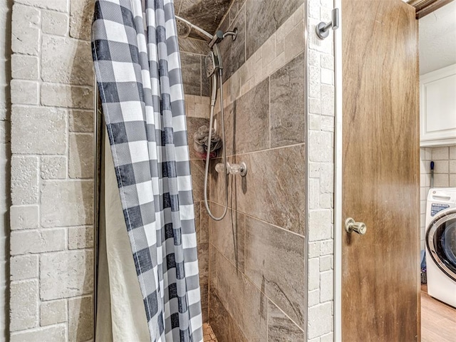 8001 84th St, Noble, OK 73068 - bathroom featuring washer / dryer and a tile shower