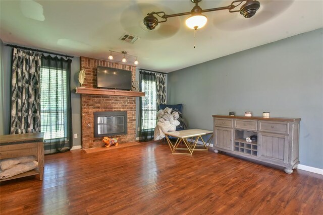 1107 W Windsor Way, Mustang, OK 73064 - living area featuring a fireplace and wood finished floors