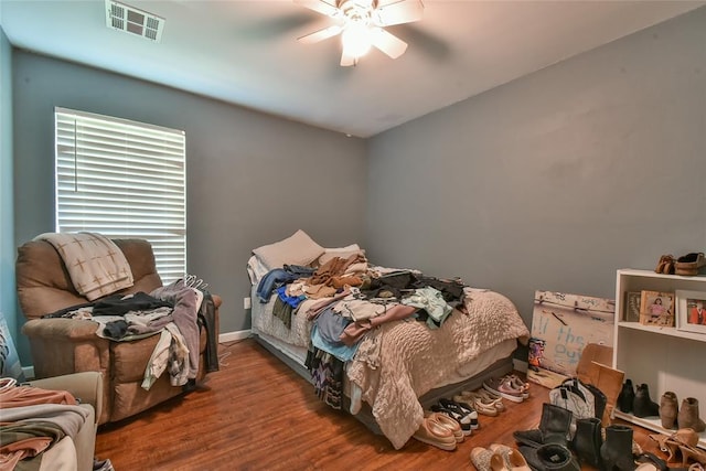 1107 W Windsor Way, Mustang, OK 73064 - bedroom with wood finished floors and a ceiling fan