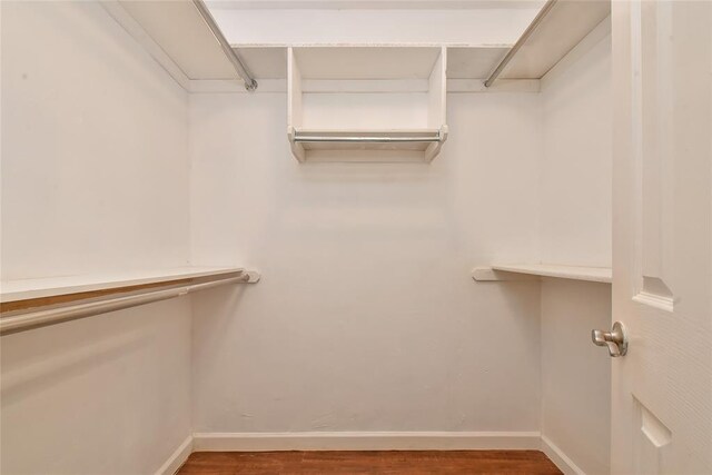 1107 W Windsor Way, Mustang, OK 73064 - walk in closet with wood finished floors