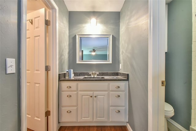 1107 W Windsor Way, Mustang, OK 73064 - bathroom featuring vanity and wood finished floors