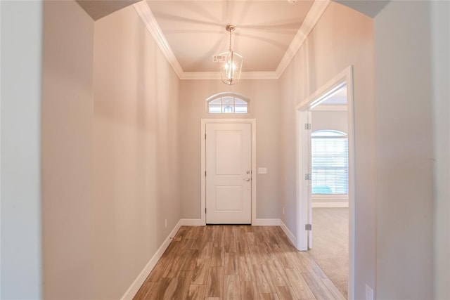 12037 Ashford Dr, Yukon, OK 73099 - foyer featuring ornamental molding, light wood-style floors, and a chandelier