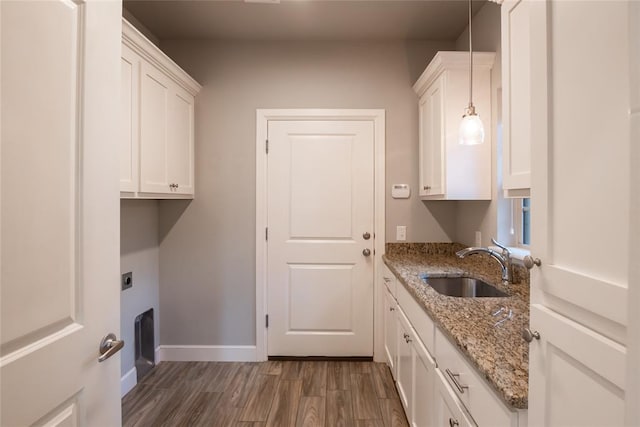 12037 Ashford Dr, Yukon, OK 73099 - laundry room with cabinet space, dark wood finished floors, and electric dryer hookup