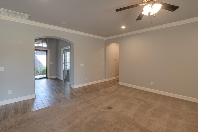 12037 Ashford Dr, Yukon, OK 73099 - carpeted spare room with arched walkways, crown molding, ceiling fan, recessed lighting, and wood finished floors